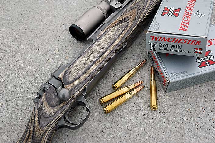 This Ruger Scout Rifle wears a laminated stock: strong, stable, more affordable than “stick” walnut.
